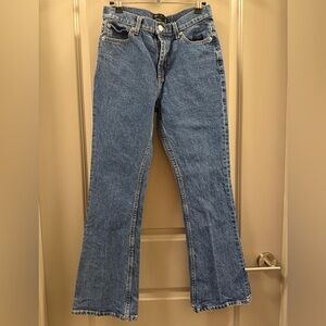 ASOS DESIGN Petite mid rise flare jeans in mid blue